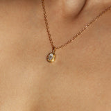 Maison de Femmes gold vermeil April Moissanite Birthstone Necklace worn by woman.