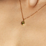 Maison de Femmes gold vermeil August Peridot Birthstone Necklace worn by woman.