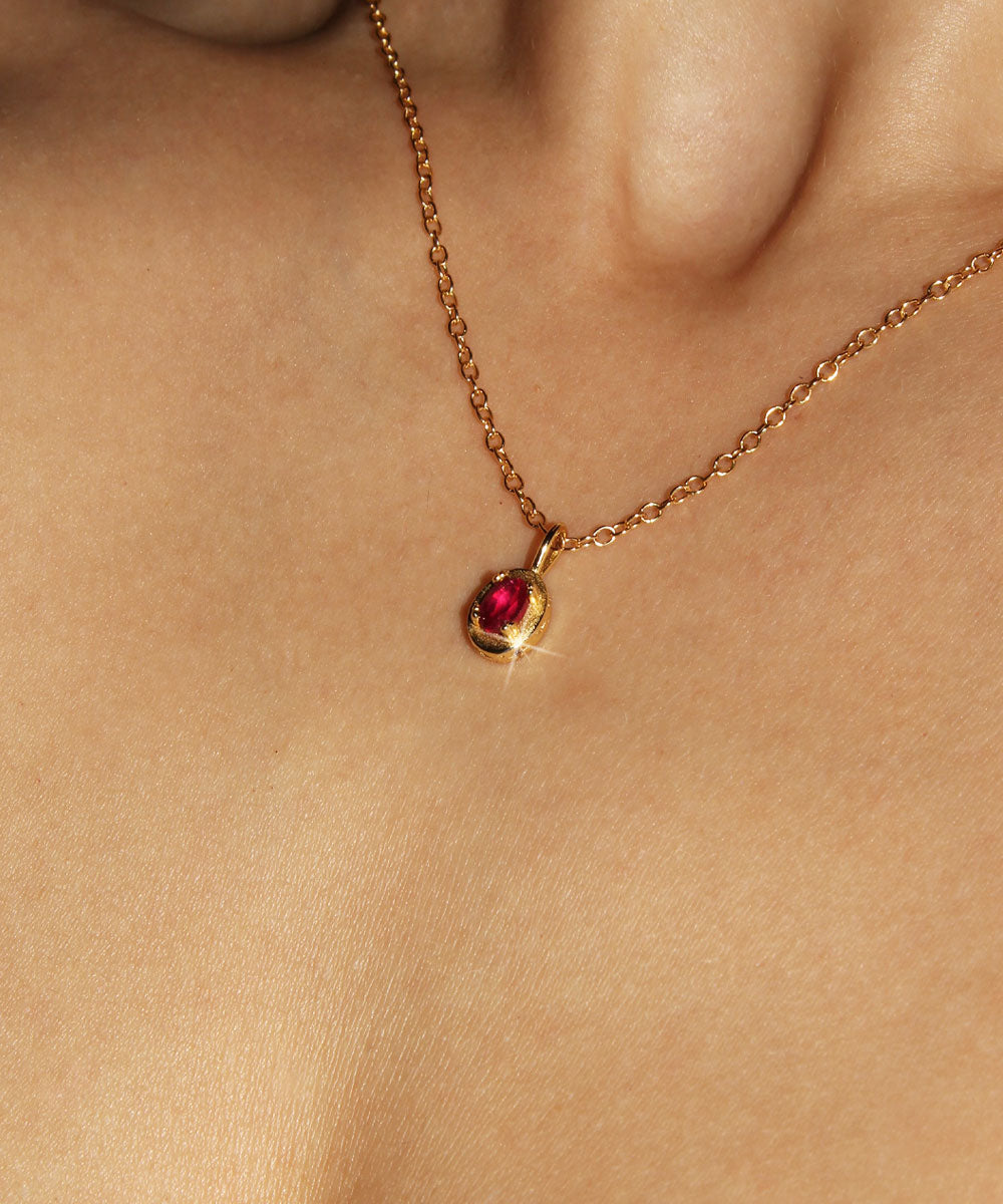 Maison de Femmes gold vermeil July Ruby Birthstone Necklace worn by woman.