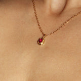 Maison de Femmes gold vermeil July Ruby Birthstone Necklace worn by woman.