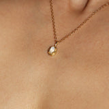 Maison de Femmes gold vermeil June Moonstone Birthstone Necklace worn by woman.