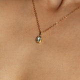 Maison de Femmes gold vermeil March Aquamarine Birthstone Necklace worn by woman.