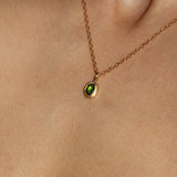 Maison de Femmes gold vermeil May Emerald Birthstone Necklace worn by woman.