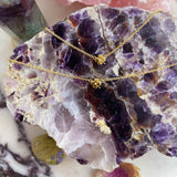 Maison de Femmes gold vermeil four leaf clover necklace and bracelet on chevron amethyst stone.