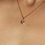 Maison de Femmes gold vermeil December Tanzanite Birthstone Necklace worn by woman.