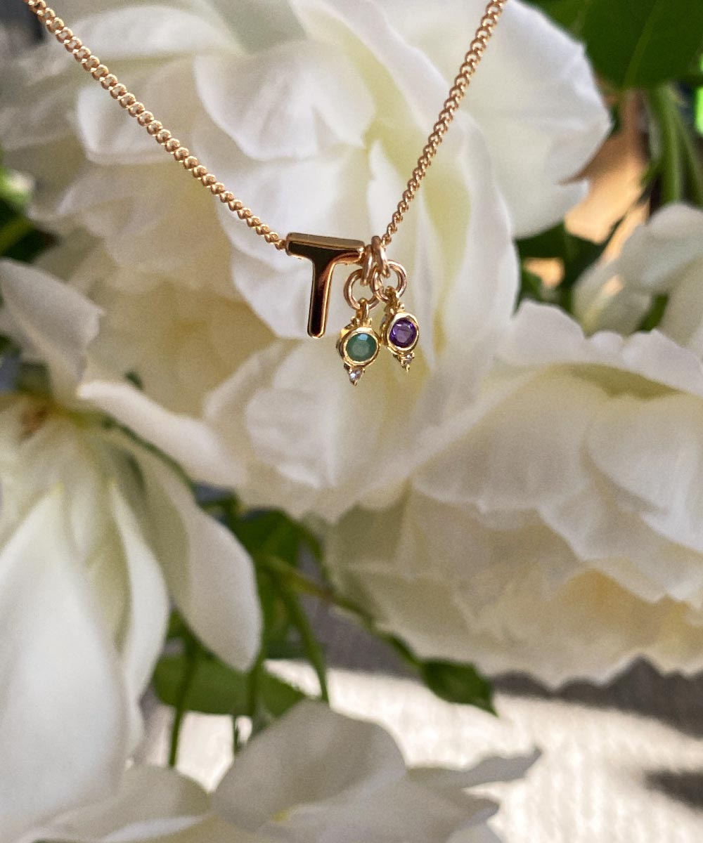T Initial with May Emerald Birthstone Charm and February Amethyst Birthstone Charm Necklace. Maison de Femmes.