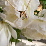 T Initial with May Emerald Birthstone Charm and February Amethyst Birthstone Charm Necklace. Maison de Femmes.