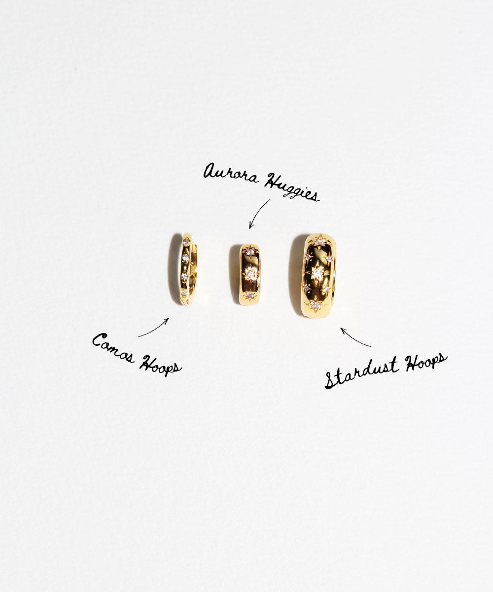 Star Studded Cosmic Celestial Hoop Earrings from the Maison de Femmes Galaxia Collection with sun and moon charms worn by woman.