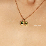 Maison de Femmes gold vermeil May Emerald Birthstone and August Peridot Birthstone Necklace worn by woman.