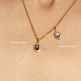 Maison de Femmes gold vermeil September Sapphire Birthstone and December Tanzanite Birthstone worn on a gold filled necklace on woman.