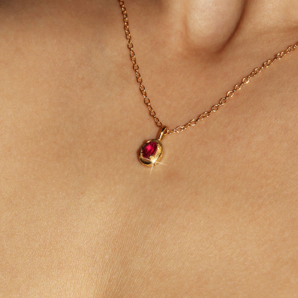 Maison de Femmes gold vermeil July Ruby Birthstone Necklace worn by woman.