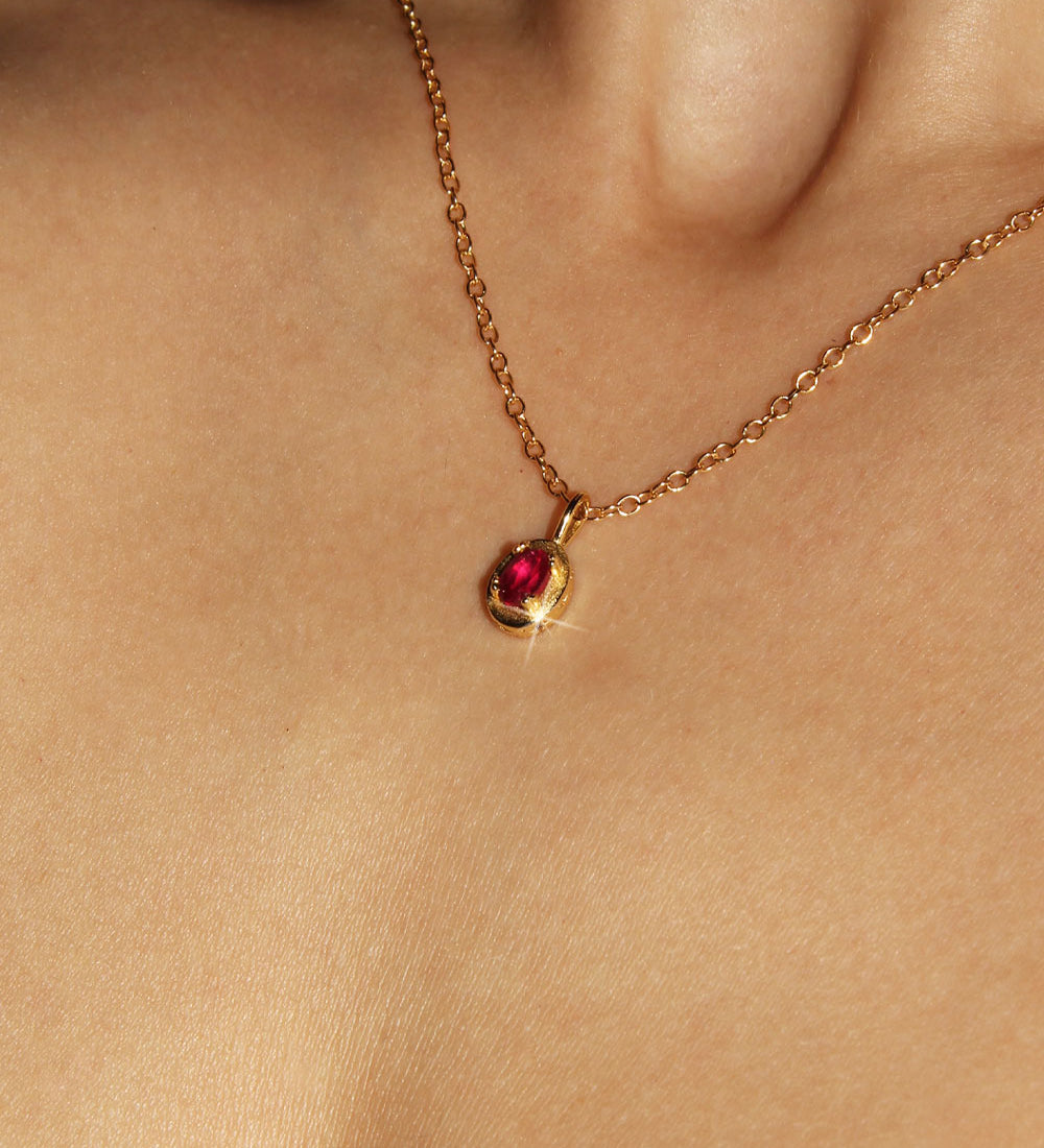 Maison de Femmes gold vermeil July Ruby Birthstone Necklace worn by woman.
