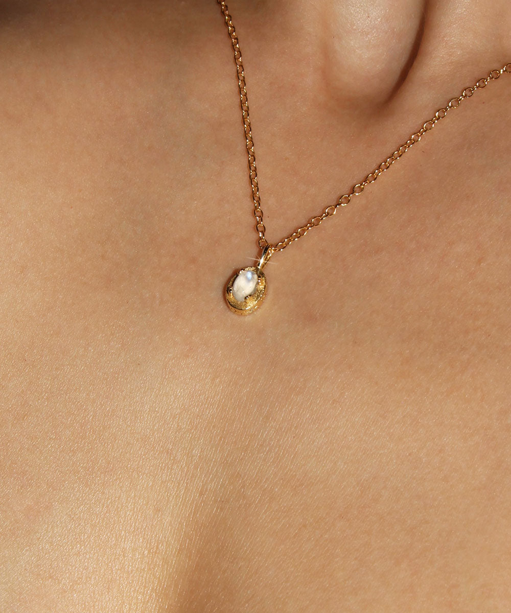 Maison de Femmes gold vermeil June Moonstone Birthstone Necklace worn by woman.