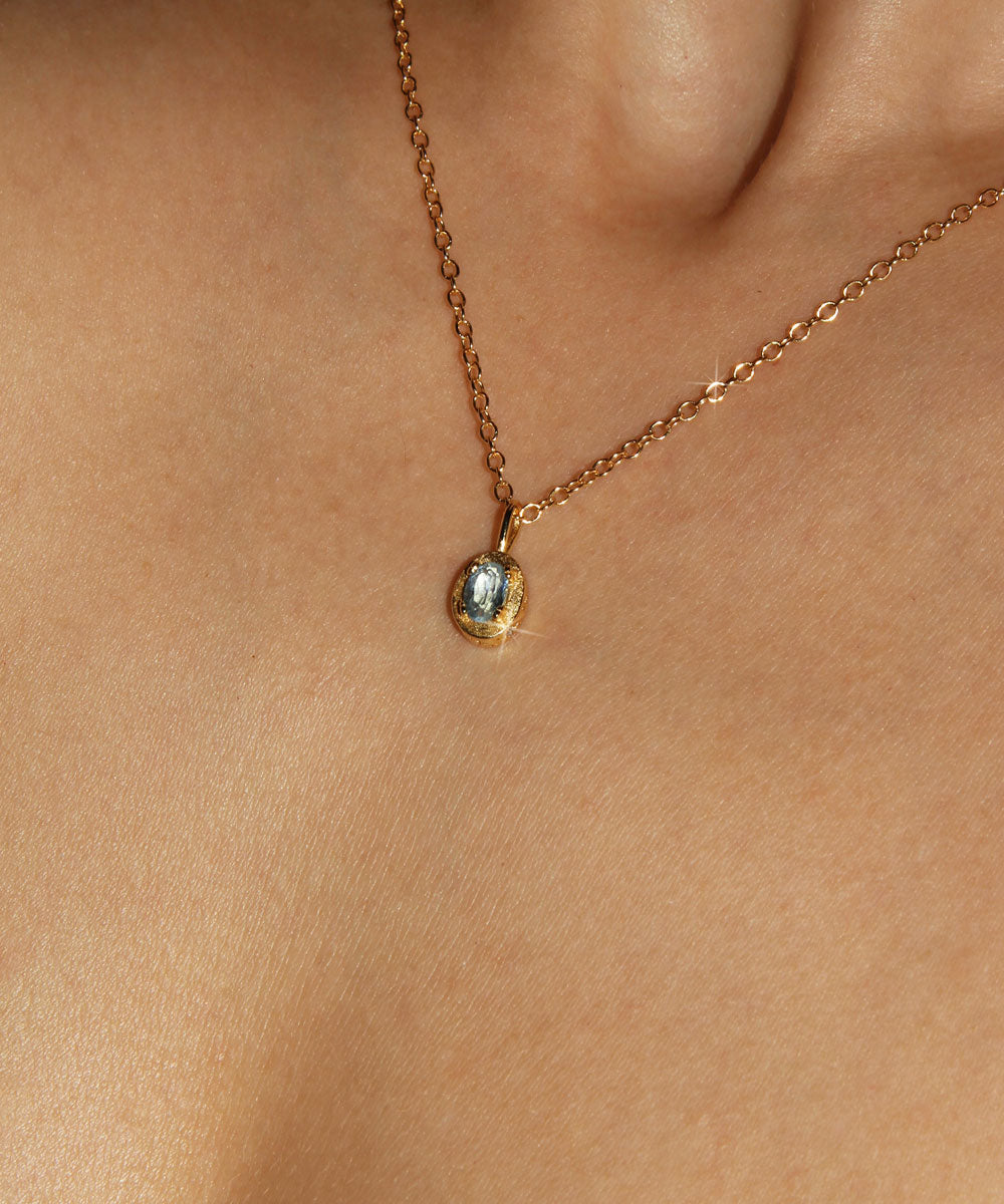 Maison de Femmes gold vermeil March Aquamarine Birthstone Necklace worn by woman.