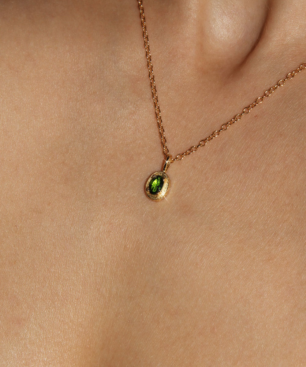 Maison de Femmes gold vermeil May Emerald Birthstone Necklace worn by woman.