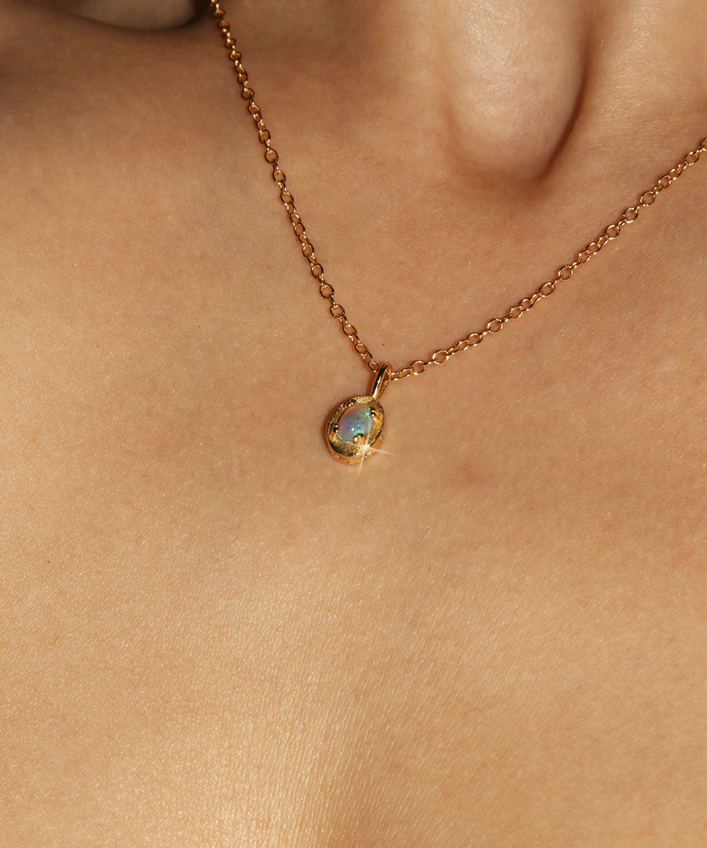 Maison de Femmes gold vermeil October Opal Birthstone Necklace worn by woman.