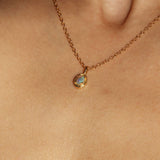 Maison de Femmes gold vermeil October Opal Birthstone Necklace worn by woman.