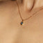 Maison de Femmes gold vermeil September Sapphire Birthstone Necklace worn by woman.