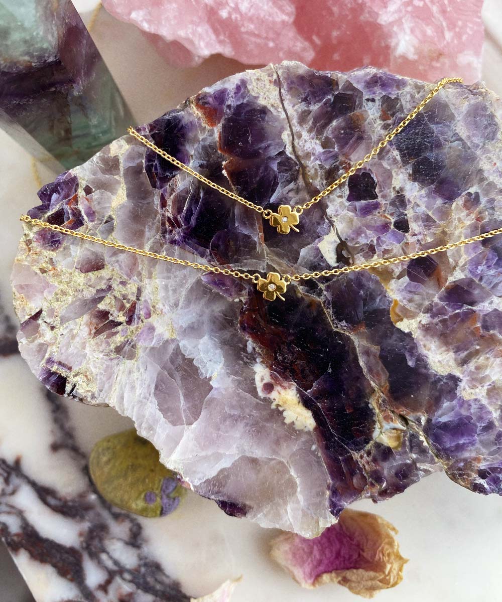 Maison de Femmes gold vermeil four leaf clover necklace and bracelet on chevron amethyst stone.