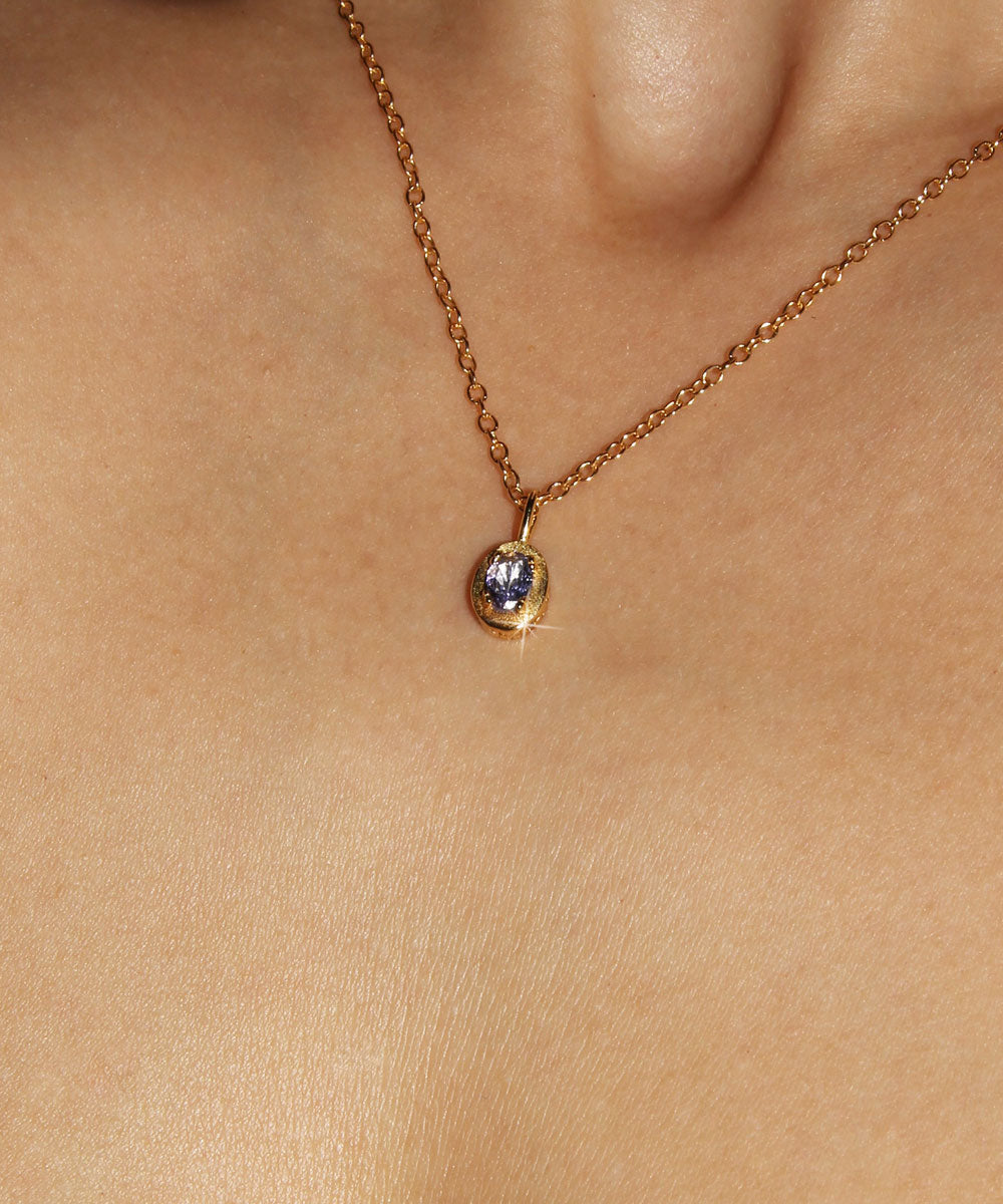 Maison de Femmes gold vermeil December Tanzanite Birthstone Necklace worn by woman.
