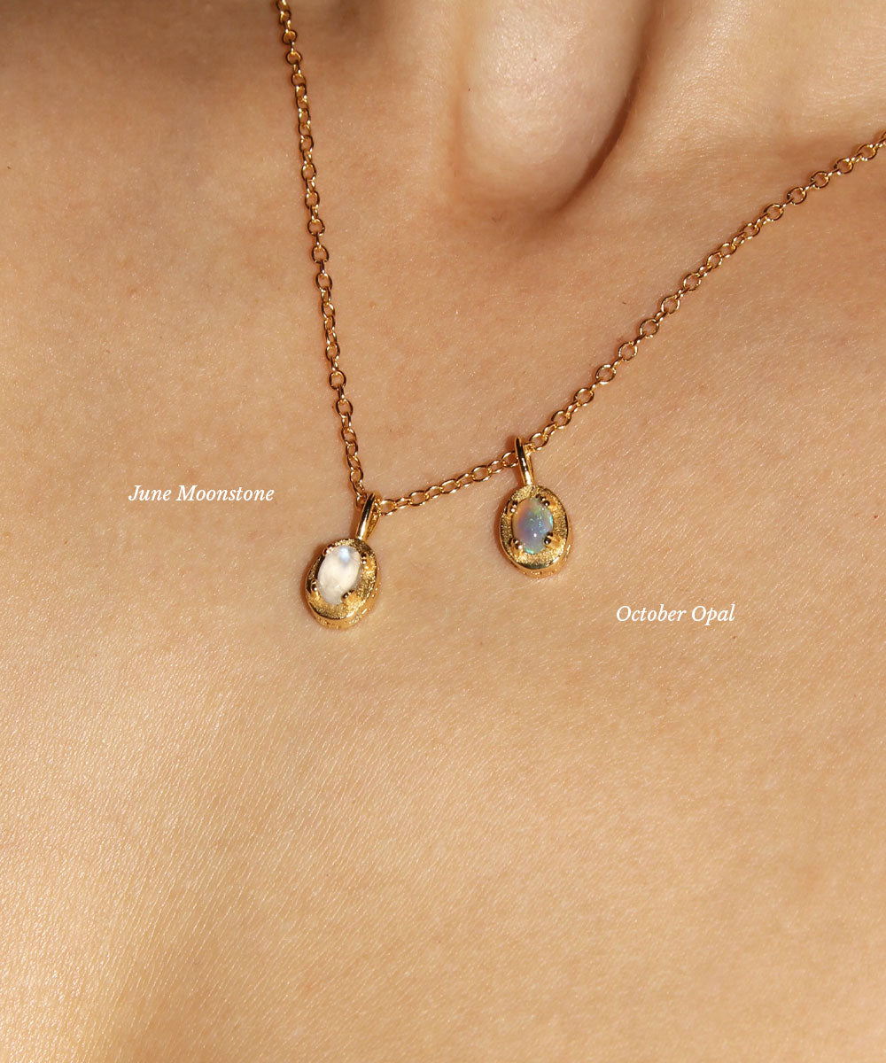 Maison de Femmes gold vermeil June Moonstone Birthstone and October Opal Birthstone Necklace worn by woman.