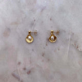 Clam shell studs with freshwater pearl