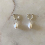 Sterling silver earrings with freshwater pearls.