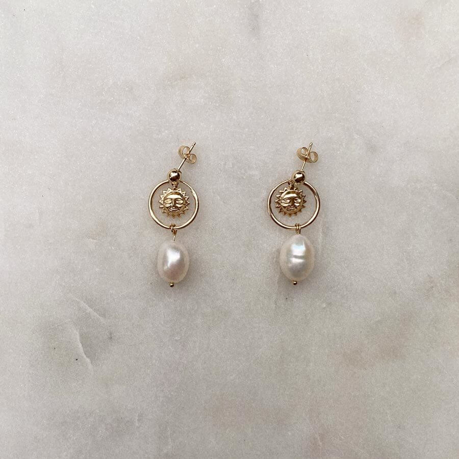 Gold Filled earrings with smiling suns and freshwater pearls.