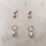 Gold Filled earrings with smiling suns and freshwater pearls.