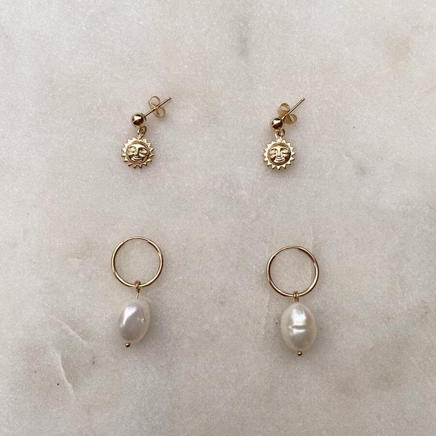 Gold Filled earrings with smiling suns and freshwater pearls.