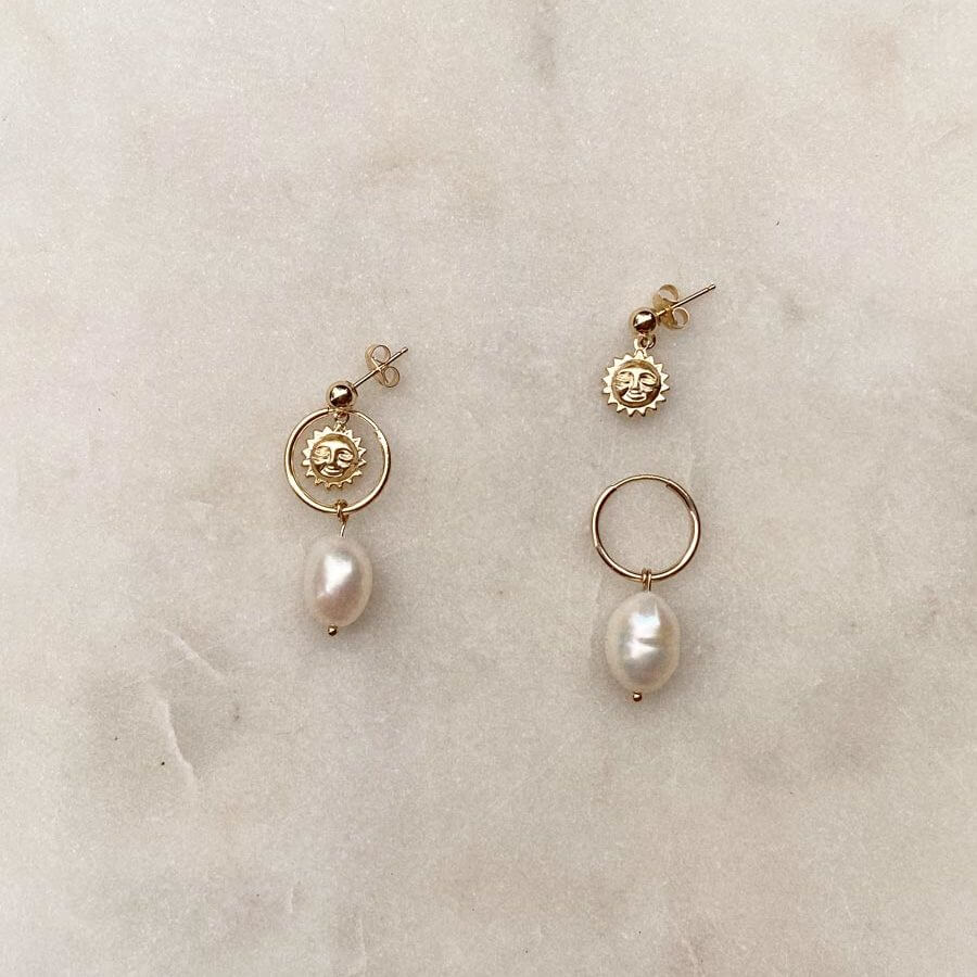 Gold Filled earrings with smiling suns and freshwater pearls.